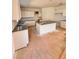 Modern kitchen featuring light cabinetry and an island with granite countertops at 7216 Eton Ln, Locust Grove, GA 30248