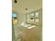 A bright and airy unfinished room featuring multiple windows allowing natural light and an outside view at 7216 Eton Ln, Locust Grove, GA 30248