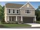 Charming two-story home with a covered porch, attached garage, and landscaped front yard at 7204 Eton Ln, Locust Grove, GA 30248