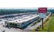 Aerial view of the Tanger Outlets shopping center with stores and parking lots at 7204 Eton Ln, Locust Grove, GA 30248