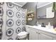 Bathroom with a white vanity, decorative shower curtain, mirror, and shelves at 1491 Stonington Ct, Villa Rica, GA 30180