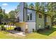 Back of house with an outdoor patio, a deck, and natural landscaping at 1491 Stonington Ct, Villa Rica, GA 30180