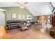 Open floor plan featuring a living room, dining area, and kitchen with hardwood floors at 1491 Stonington Ct, Villa Rica, GA 30180