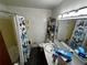 Practical bathroom featuring a tub/shower combo, vanity with a sink, and ample storage options for toiletries and essentials at 2933 Arlington Rd, East Point, GA 30344