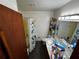 Functional bathroom with a combined tub and shower, a single sink vanity, and essential fixtures for daily convenience at 2933 Arlington Rd, East Point, GA 30344