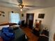 Simple bedroom with hardwood floors, closet space, and a ceiling fan, providing a comfortable and functional space for rest at 2933 Arlington Rd, East Point, GA 30344