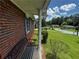 Inviting front porch with white pillars and a bench, offering a relaxing spot to enjoy the neighborhood view at 2933 Arlington Rd, East Point, GA 30344