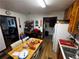 Efficient kitchen space with a dining table, refrigerator, and view into the mudroom, offering practicality at 2933 Arlington Rd, East Point, GA 30344