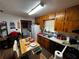 Cozy kitchen featuring wood cabinets, functional appliances, and a breakfast area perfect for casual dining and everyday living at 2933 Arlington Rd, East Point, GA 30344