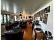 Spacious living room with hardwood floors, leather furniture, and abundant natural light, ideal for relaxing and entertaining guests at 2933 Arlington Rd, East Point, GA 30344
