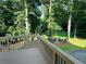 Spacious backyard view from deck, featuring a cozy fire pit area for outdoor gatherings at 3201 Palisades Se Ct, Marietta, GA 30067