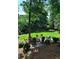 Backyard view of seating area with mature trees at 3201 Palisades Se Ct, Marietta, GA 30067