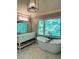 Relax in the freestanding tub in this luxurious primary bathroom with double vanities and stylish fixtures at 3201 Palisades Se Ct, Marietta, GA 30067