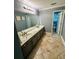 Traditional bathroom with a large double vanity, neutral tile floors, and view of the toilet at 3201 Palisades Se Ct, Marietta, GA 30067
