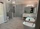 This primary bathroom features a soaking tub, separate glass enclosed shower and double sink vanity at 3201 Palisades Se Ct, Marietta, GA 30067