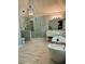 Luxurious bathroom featuring a soaking tub, walk-in shower with marble tile, and double vanity at 3201 Palisades Se Ct, Marietta, GA 30067