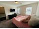 Comfortable bedroom with two windows and a TV, offering a relaxing space at 3201 Palisades Se Ct, Marietta, GA 30067