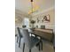 Bright dining room with large dining table, stylish light fixture, and modern decor at 3201 Palisades Se Ct, Marietta, GA 30067
