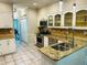 Spacious kitchen with granite countertops, stainless steel appliances, white cabinetry and tile floors at 3201 Palisades Se Ct, Marietta, GA 30067
