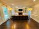 Spacious living room featuring a fireplace, built-in shelving, and hardwood floors at 3201 Palisades Se Ct, Marietta, GA 30067