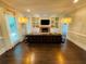 Inviting living room with hardwood floors, a brick fireplace with built-ins, and bright windows at 3201 Palisades Se Ct, Marietta, GA 30067