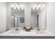 Bright bathroom featuring double vanity with framed mirrors, modern lighting and a glass shower at 508 Crown Dr, Emerson, GA 30137