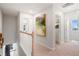 Upstairs hallway with neutral carpet and decor leading to bedrooms, offering a cohesive and inviting transition at 508 Crown Dr, Emerson, GA 30137