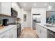 Contemporary kitchen featuring white cabinets, stainless steel appliances, and an island with seating at 508 Crown Dr, Emerson, GA 30137