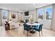Open concept living room with many windows, dining area, a fireplace, and hardwood floors at 508 Crown Dr, Emerson, GA 30137