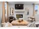 Living room featuring a fireplace, large-screen television, abundant natural light, and wood floors at 508 Crown Dr, Emerson, GA 30137