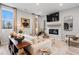 Living room featuring fireplace, large-screen television, wood floors, and abundant natural light at 508 Crown Dr, Emerson, GA 30137