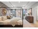 Luxurious main bedroom with tray ceilings, patterned wallpaper, and a four-poster bed for added drama and elegance at 508 Crown Dr, Emerson, GA 30137