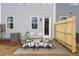 Back patio space with modern outdoor furniture, perfect for relaxation and entertaining at 508 Crown Dr, Emerson, GA 30137