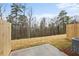 Newly sodded backyard with wooden fence and concrete patio at 512 Crown Dr, Emerson, GA 30137