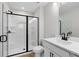Modern bathroom boasts a sleek, glass-enclosed shower with black trim at 512 Crown Dr, Emerson, GA 30137