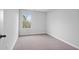 Bright bedroom featuring carpet floors, a window bringing in natural light, and neutral walls at 512 Crown Dr, Emerson, GA 30137
