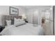 Neutrally decorated bedroom with a plush upholstered headboard and an open closet at 512 Crown Dr, Emerson, GA 30137