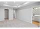 Bedroom with carpet floors, neutral walls, tray ceiling, closet and doorway to the bathroom at 512 Crown Dr, Emerson, GA 30137