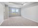 Bright bedroom featuring carpet floors, two windows bringing in natural light, and neutral walls at 512 Crown Dr, Emerson, GA 30137