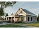 Exterior of clubhouse with stone accents, covered porch, and lush landscaping at 512 Crown Dr, Emerson, GA 30137