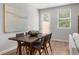 Cozy dining room with stylish wood table and chairs, filled with natural light at 512 Crown Dr, Emerson, GA 30137