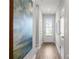 Hallway with wood flooring, white doors, and access to a back door at 512 Crown Dr, Emerson, GA 30137
