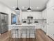 Modern kitchen featuring white cabinets, stainless steel appliances, and center island with seating at 512 Crown Dr, Emerson, GA 30137