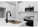 Modern kitchen featuring stainless steel appliances, subway tile backsplash, and quartz countertops at 512 Crown Dr, Emerson, GA 30137