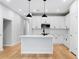 Bright kitchen with an island, stainless steel appliances, and stylish pendant lighting at 512 Crown Dr, Emerson, GA 30137