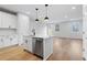 Modern kitchen featuring a center island with stainless steel appliances and ample counter space at 512 Crown Dr, Emerson, GA 30137