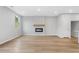 Bright living room with a modern fireplace and light wood flooring at 512 Crown Dr, Emerson, GA 30137