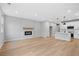 Wide angle view of a living room with kitchen and electric fireplace at 512 Crown Dr, Emerson, GA 30137