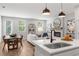 Open concept living room with wood floors, fireplace, and modern decor at 512 Crown Dr, Emerson, GA 30137