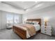 Spacious main bedroom with a tray ceiling, large windows, and a stylish furniture at 512 Crown Dr, Emerson, GA 30137